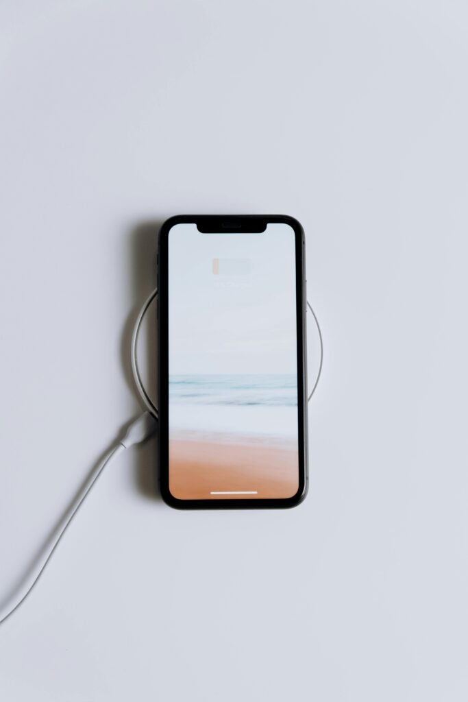 Wireless charging pad with an iPhone placed on it